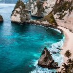 A breathtaking view of Nusa Penida's turquoise waters and rocky cliffs in Bali, Indonesia.